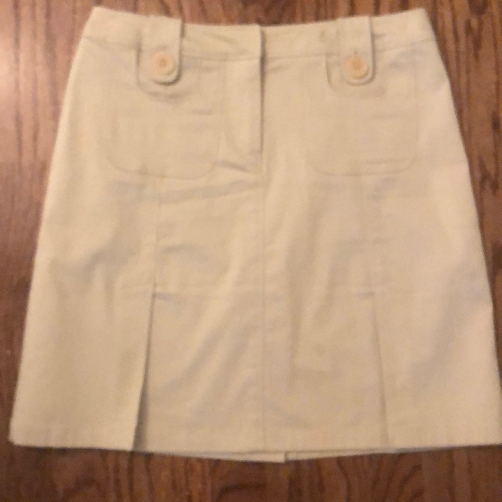 Harold’s pleated tan skirt